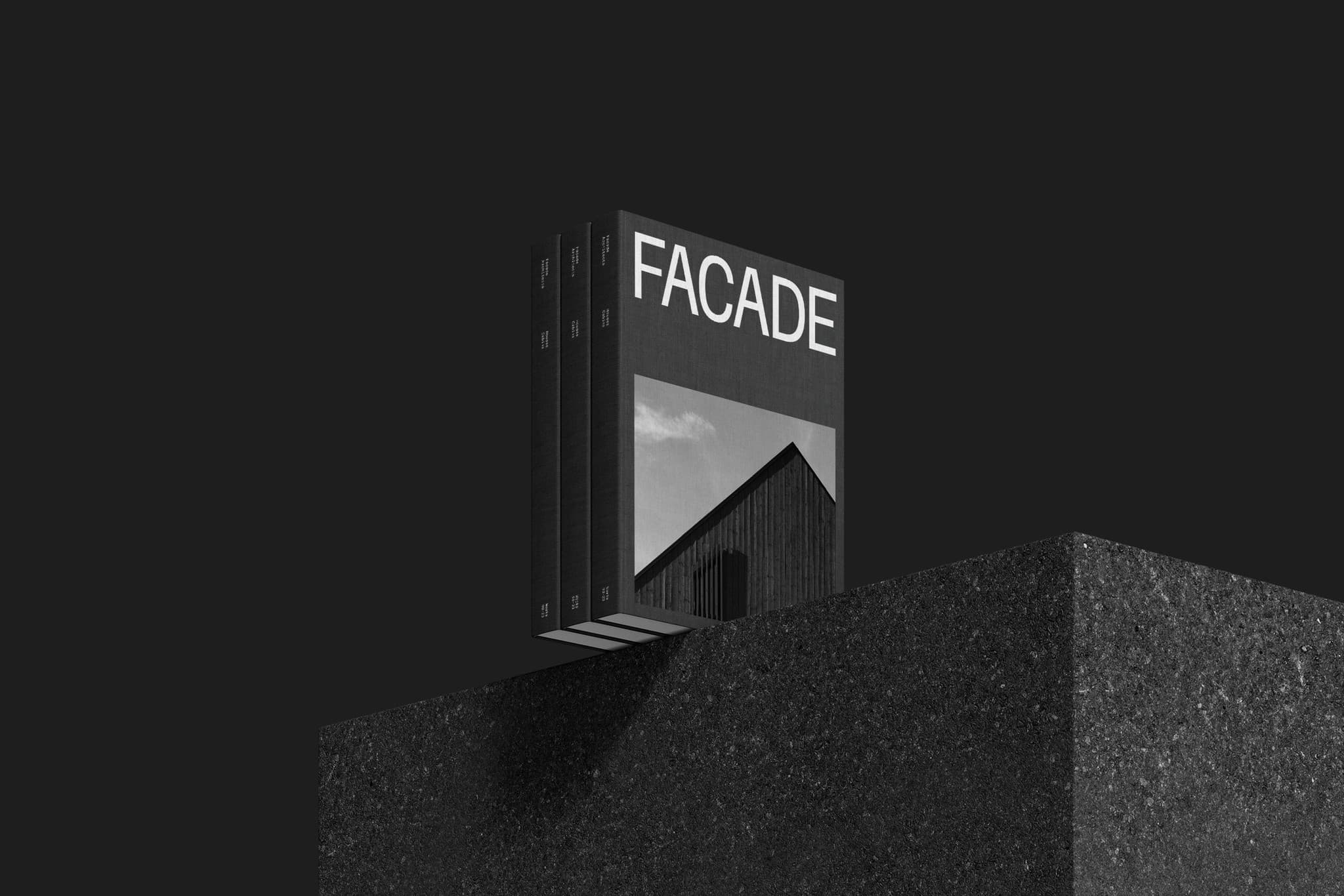 The black Facade architecture catalogue displayed on a textured plinth